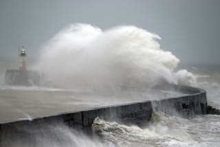 Waves crash into the wall at Newhaven south east England, as Storm Ciara, named by the Met Office national weather agency, hits the UK, Sunday Feb. 9, 2020.