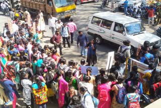 Protest opposing partiality in free laptop distribution