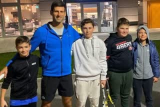 Djokovic joins kids for a tennis game on the streets of his home city