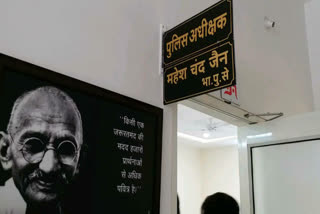 Posters of Gandhi writing slogans in every police station