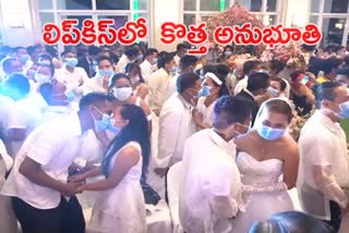 newly married couple kissed with mask