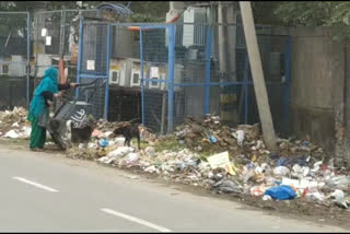 MCD employees  spreading dirt outside the government school wall