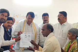 speaker pocharam distributed by land passbooks for farmers in nizamabad