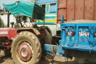 Action on a sand-loaded tractor-trolley