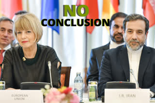 Helga Schmid, left front, Deputy Secretary General for Political Affairs of the European External Action Service and Iranian Deputy Foreign Minister Abbas Araqchi, right front.