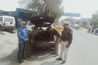 Dwarka District police are checking the vehicles by putting a picket