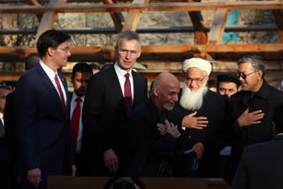 Afghan President Ashraf Ghani, center, arrives with NATO Secretary General Jens Stoltenberg, and U.S. Secretary of Defense Mark Esper for a joint news conference in presidential palace in Kabul, Afghanistan