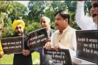 AAP MPs stage protest in Parliament premises over Delhi violence