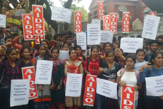 aidso students org protests demanding free laptops from the state bjp government