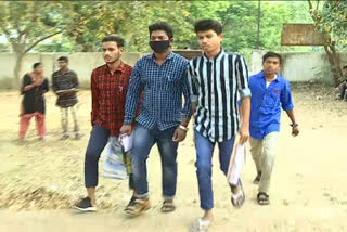 inter students wearing masks while attending to examinations