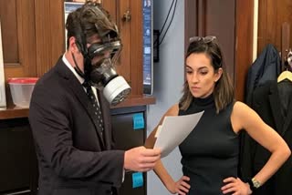 US politician wears gas mask