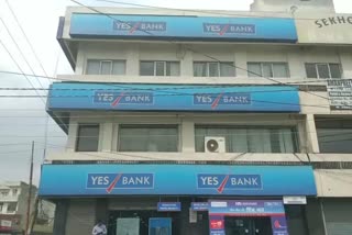 panic among yes bank customers after new rules