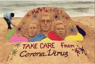 Sand artist extends Holi greetings, awares people on coronavirus