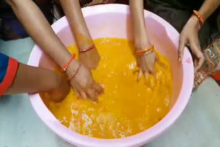 holi celebrations with turmeric  powder in nirmal