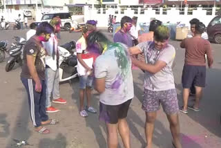 Holi celebrating bustling on the ocean shore