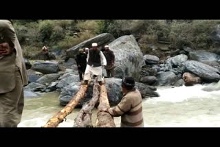 People crossing  the drain putting their lives at risk in chamba