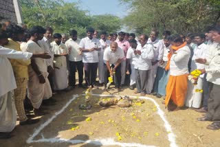 MLA D.S Holageri does puja to road constructional work