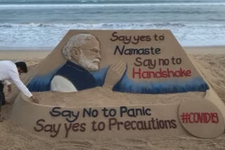 Corona alert message in sand art, YES TO NAMASTE, NO TO HANDSHAKE