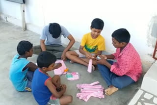 children distribute masks to control carona at east godaari district