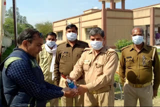 people have to clean their hands with sanitizer Before entering Dadri tehsil in noida