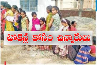 Children waiting for groundnut crop tokens in Nirmal Bhimsa