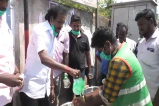 dmk providing masks and hand sanitizer for sanitary workers