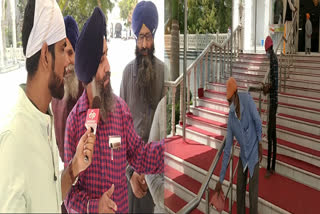 Sanitizer being given to people at Rakabganj Gurudwara