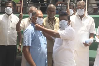 corona precautionary activities tmc party distributes face mask in tuticorin