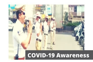 Rachakonda Traffic Police creates awareness at traffic signal in Hyderabad on COVID-19