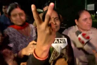 Asha Devi, mother of 2012 Delhi gang rape victim shows victory sign