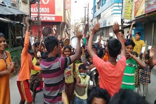 malda-procession with bell plate glass-