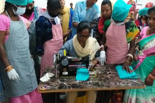 women of self help group making masks and hand sanitizers in chaibasa