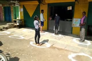 Marking outside shops to maintain social distancing in Balodabazar