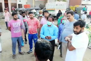 people gathered in vegetable market