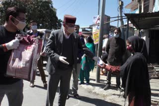 Assembly Speaker distributed sanitizer and mask to people, instructed to stay in homes