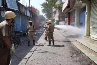 Raiganj firebrigade against corona, sanitizer finyle sprayed in markets