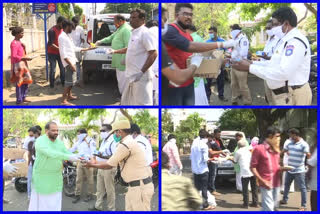 food and water bottles distribution to needy and cops at east godavari