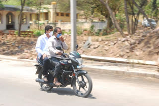 Minister Ramesh Zarakiholi Rounds on a Bike in Gokak City