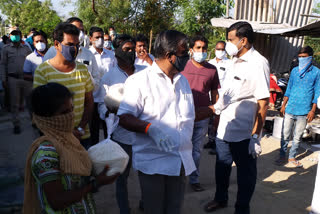 Somashekhara Reddy distributes rice bag to 500 households in Bellary