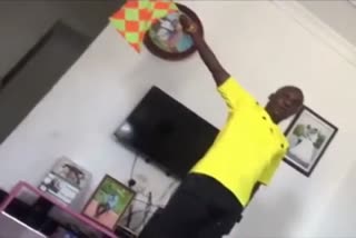 Assistant referee practises flagging offside during self isolation in Tanzania