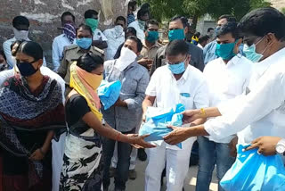 Adirimula Suresh, a minister distributed vegetables to the poor