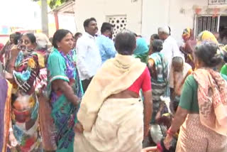 People gathered in front of the Post Office