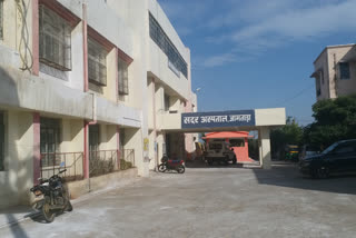 Medical workers performing duty 24 hours wearing raincoat in jamtara sadar hospital