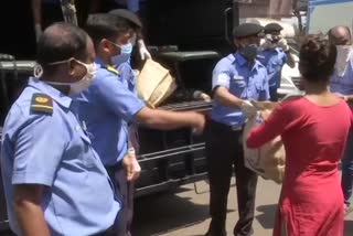 Indian Navy personnel distribute food items & ration among the needy