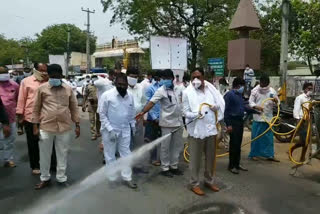 Minister Yerrabelli Dayakar Rao spraying chemicals on Mahabubad Turrur roads