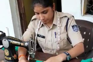 Srishti Shrotia, a female constable posted at Sagar's Khurai country station, is making a mask