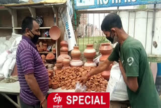 Shopkeeper selling lamps in Najafgarh