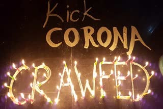 People wrote KICK Corona in Chandigarh with candles and lamps