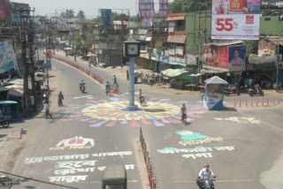 corona awareness words are painted on roads in balurghat , south dinajpur