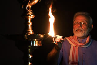 People light earthen lamps and candles in the balcony of their houses in Bengaluru. PM Modi had appealed to all to switch off all lights of their houses today at 9 PM for 9 minutes&just light candles&diyas, to mark the fight against